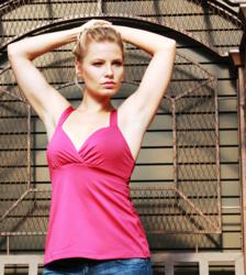 Beautiful girl wearing a gorgeous red designer yoga tank from the TerraFrog Winter 2013 Sportswear Collection.